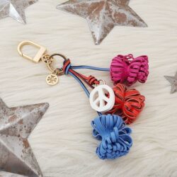 Tory Burch Peace Pompom bag charm keychain pink red blue