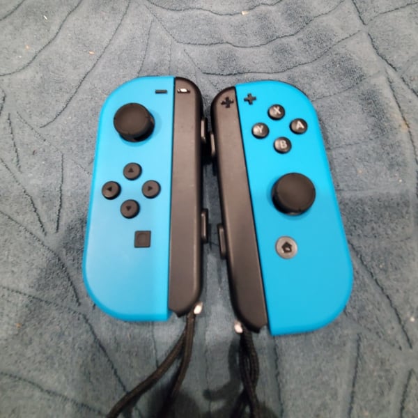 Nintendo Switch 2 NEON BLUE JOYCONS with wrist straps 100% FUNCTIONAL