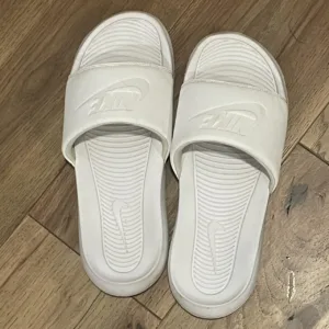 Nike Women's White Slides